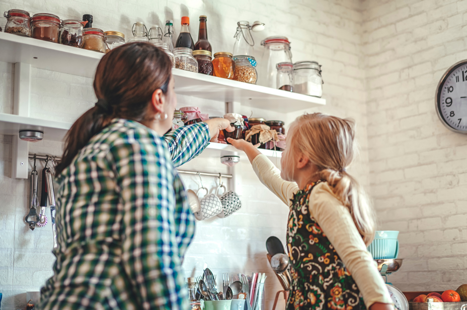 mom and daughter reaching for emergency food meal in a jar